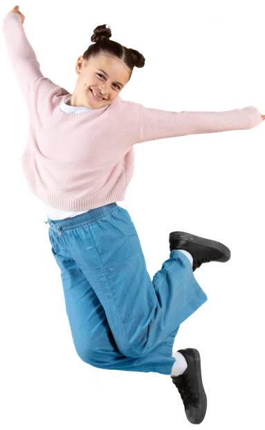 Young girl happily jumping
